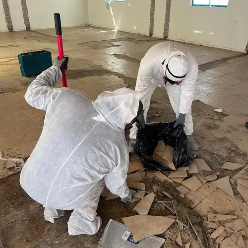 Photo shows Dryrite technicians at a job site doing fire damage cleanup to prepare for the fire damage restoration process
